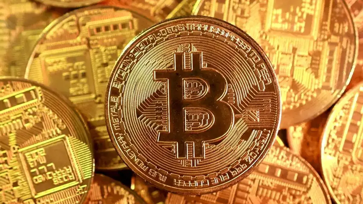 Registro fotográfico documental de Banco britânico projeta alta histórica de 614% para criptoativo Ethena: entenda a estratégia de recompra e o avanço dos ativos do mundo real no ecossistema DeFi - Foto: Reprodução / infomoney.com.br